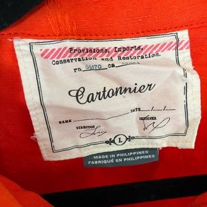 Bright orange Anthropologie Cartonnier cropped jacket.